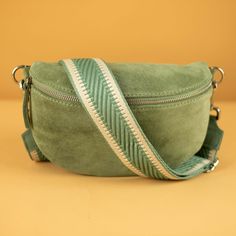 👜 ITALIEN QUALITY ➤ THE STYLISH SUEDE BAG: Waist bag, crossbody bag - perfect for leisure, vacation, weekend trips, concerts, festivals, hiking, swimming pool, and other occasions where small luggage is practical.  ➤ PRACTICAL WAIST BAG FOR WOMEN: Keep your hands free everywhere - simply strap on the suede bag and it's a great companion. Compact design, very light, and equipped with a small spacious compartment. Space for a smartphone, small wallet, keys, etc.  ➤ PERFECT COMFORT: Suede waist ba Green Crossbody Belt Bag With Removable Pouch, Green Belt Bag With Detachable Strap, Green Crossbody Belt Bag With Detachable Strap, Green Belt Bag With Removable Pouch, Trendy Green Crossbody Belt Bag, Green Belt Bag With Zipper Closure, Green Shoulder Belt Bag With Zipper Closure, Waist Bags For Women, Leather Bag For Women