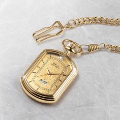 The pocket watch is a classic, elegant style. It has been around for hundreds of years and remains timeless and classy—the ultimate status symbol for men. A fancy rectangular case is set with a 24k gold foil dial that is sure to impress. A single solitaire Diamondeau®, flawless simulated diamond sits at 12 o’ clock and handy date window to keep you on track. Get yourself a piece of history with this gold foil pocket watch. Luxury Elegant Pocket Watch With Polished Finish, Classic Rectangular Watch Accessories For Formal Occasions, Rectangular Yellow Gold Watch Accessories For Formal Occasions, Luxury Yellow Gold Pocket Watch With Chronometer, Gold Rectangular Chronometer Watch, Timeless Yellow Gold Rectangular Watch, Timeless Rectangular Gold Watch Accessories, Timeless Rectangular Chronometer Watch, Timeless Gold Rectangular Watch Accessories