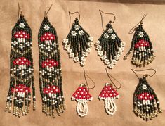 several beaded earrings are displayed on a piece of paper