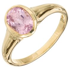 Pastel pink tourmaline bezel set Bvlgari ring. 1.68ct pink oval bezel set Tourmaline, 18k yellow gold setting. 1 oval pink tourmaline, approx. 1.68cts Size 8.25 and sizable 18k yellow gold Stamped: 750 Hallmark: Bvlgari 4.8 grams Formal Pink Sapphire Ring With Bezel Setting, Classic Pink Bezel Set Ring, Classic Pink Rings With Bezel Setting, Pink Oval Ring With Bezel Setting, Oval Pink Ring With Bezel Setting, Classic Pink Oval Cabochon Ring, Pink Oval Sapphire Ring With Bezel Setting, Bvlgari Ring, Rose Pastel