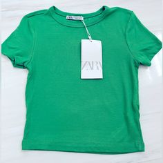 Zara Kelly Green Crew Neck Baby Tee Shirt. New With Tags! Size Small. Perfect Condition! Color Is Stunning! Great & On Trend For Spring & Summer! Dress Up Or Down! Perfect With Jeans, Shorts, Leggings, Skirts. 96% Viscose/4% Elastane Basic Zara Cotton Top, Cute Green Crew Neck Top, Zara Basic Cotton Top, Fitted Green Zara Tops, Cute Fitted Zara Top, Basic Fitted Zara T-shirt, Zara T-shirt For Spring, Zara Solid Color T-shirt For Spring, Basic Zara T-shirt For Spring