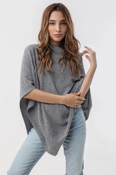 Handcrafted of pure, smooth, light and soft cashmere, this versatile pull-on style features an elegant draped neck, a relaxed fit and asymmetrical trim. The effortless design compliments casual and dress beautifully, and will take you from desk to dinner with ease. Timeless in style, this outfit topper will become your go-to seasonal favorite. Perfect for people with wool intolerance or fiber fussiness. Designed by MIKAINE Switzerland and crafted in Italy. 100% cashmere One Size 25" W x 26" L at Cashmere Poncho, Wool Poncho, Elegant Drapes, Everyday Luxury, Lattice Pattern, Siena, Stay Warm, Switzerland, Merino Wool