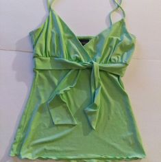 Brand: Inc International Concepts Item: Asymmetrical Spaghetti Strap Tank Top Condition: New Without Tags; Kept In Amazing Condition Size: Large, Grande Color: Green; Mint Green, Pastel Lime Shade Design And Features: Front Bow Tie At The Bust Snithced At The Bust Flowy Bottom V Neckline Hits At Waist Length Not Short, Not Crop Length 95% Polyester 5% Spandex Machine Wash Cold Gentle Cycle With Like Colors Only Non-Chlorine Tumble Dry Medium Bundle With Other Camis And Sleeveless Tanks For A Gre Strappy Stretch Summer Tops, Strappy Stretch Tops For Summer, Fitted V-neck Camisole For Summer, Stretch Strappy Summer Tops, Fitted Strappy Camisole For Spring, Summer Cotton V-neck Camisole, Casual Summer Tops With Straps, Green Cotton Camisole With Tank Straps, Green Cotton Tank Camisole