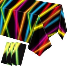 the table cloth is multicolored and has black background with bright lines on it