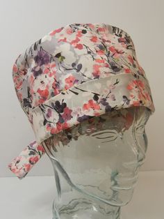 TIE BACK SCRUB HAT ITEM DETAILS.... *Cherry Blossom Floral in Pink, Gray, Lavender *STOCK PHOTO USED.  Due to the nature of handmade items, pattern placement will vary. *COLORS may vary slightly from images shown.   *ONE SIZE.  Features ADJUSTABLE FOLDING BAND and ties to help achieve that perfect, comfortable fit!   *Features covered elastic in the back to keep fabric gathered and neat and also to keep hair covered. *Made from unwashed, 100% premium cotton fabric.   *Machine washable.  Low heat Spring Beach Bonnet Fitted, Fitted Beach Bonnet For Spring, Fitted Spring Beach Bonnet, Fitted Bonnet Cap For Spring, Casual Fitted Bonnet For Spring, Fitted Casual Spring Bonnet, Casual Fitted Spring Bonnet, Adjustable Pre-tied Spring Hat, Adjustable Lavender Hat For Spring