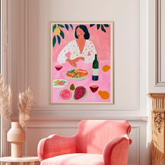 a pink chair sitting in front of a painting on the wall next to a table