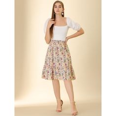 Made of floral-printed fabric, this midi skirt is high-waisted featuring an A-line silhouette. This flowy midi skirt with a tiered design and vintage allover floral prints. Featuring an A-line and tiered details, it is a summer casual skirt to be paired well with a top and sandals for a cute day look and with a stylish T-shirt and vintage high heels for a charming inspired look. Floral Print Midi Skirt For Brunch, Midi Floral Print Skirt For Brunch, Feminine Midi Length Skirt For Garden Party, Flowy Floral Print Maxi Skirt, Floral Print Midi Skirt For Day Out, Floral Print Flared Skirt For Brunch, Floral Print Skirt For Brunch, Floral Print Relaxed Skirt For Brunch, Relaxed Floral Print Skirt For Brunch