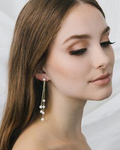 Elegance meets drama in our Kendall Pearl Earrings. These duster earrings are designed with off white pearls dangling from delicate chains of varying lengths. Lightweight for easy day to night wear. Off white, glass pearls Measures 3" in length Hypoallergenic, lead-free & nickel-free Style #4458 Dangle Pearl Earrings With Adjustable Chain, Pearl Drop Dangle Linear Earrings, Pearl White Linear Dangle Earrings With Pearl Charm, Pearl Chandelier Drop Earrings With Pearl Chain, White Pearl Chain Linear Earrings For Party, White Pearl Long Drop Earrings, Long Drop Pearl Chandelier Earrings For Party, Pearl Dangle Chandelier Earrings For Evening, Pearl Chain Dangle Chandelier Earrings For Party