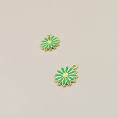 Green Flower 2 in 1 Charm, Single Daisy Pendant, Green Flower on Gold Pendant, Flower For Earrings or Necklace Making, 4 Pieces  Dimensions: 15*18mm Material: Enamel, Metal Primary Colour: Green Quantity: 4 Pieces Please Note: Due to the small size of these items, we do not recommend them for use by younger children. Green Flower Charm Jewelry, Nickel-free Green Flower Shaped Jewelry, Green Nickel-free Flower-shaped Jewelry, Green Flower Earrings For Gifts, Green Flower Shaped Jewelry With Floral Decoration, Green Flower-shaped Jewelry With Flower Decoration, Daisy Pendant, Dangle Hoop Earrings, Necklace Making