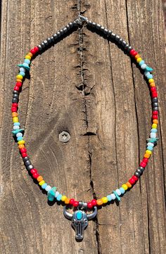 western beaded necklace with bull charm 16 in but can be extended to 18 in with extender Southwestern Style Choker Necklace With Colorful Beads, Southwestern Style Colorful Bead Choker Necklace, Western Style Beaded Necklaces For Festivals, Southwestern Single Strand Necklace For Festivals, Western Beaded Necklaces For Festivals, Southwestern Style Colorful Beaded Choker Necklace, Southwestern Style Choker For Festivals, Southwestern Festival Choker Necklace, Southwestern Style Festival Choker Necklace