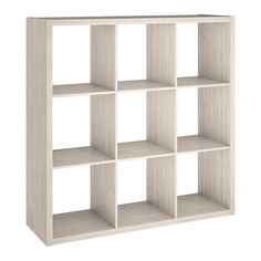 a white bookcase with six shelves on each side