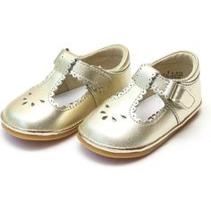 The dainty details of this scalloped t-strap from Angel Shoes make this shoe a must-have for your little girl. This style tends to run big. You may want to size down; please refer to the size chart. | Angel Shoes | Baby Dottie Scalloped T-Strap Metallic Mary Jane, Gold (Gold Metallic, Size 3)  |  Maisonette collects the best children’s products from around the world (unlike Zulily, Etsy, The Tot, Farfetch Kids, Childrensalon, Crate and Kids, Kohls, Wayfair, Buy Buy Baby, Nordstroms, Mini Boden, Angel Shoes, Shoe Wardrobe, Scalloped Trim, Gold Shoes, Shop Shoes, Crib Shoes, Buy Buy Baby, Shoes Baby, Childrens Shoes