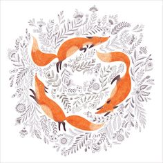 three foxes in the middle of a floral wreath