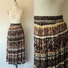 Fun vintage skirt from the 1990s in various black and brown prints. Very full with elastic waist. Tag reads: Brookside, rayon and cotton and gives a size of Medium but do see measurements below.  Excellent vintage condition.  I haven't found anything worth noting. Measurements when lying flat. Doubled at waist and hip. Waist: 27" at rest up to about 38" stretched Hip: loose Waist to bottom hem: 35.5" Please note: These are vintage, preworn and/or preloved items. I do my utmost best to list any issues, but signs of wear should be expected, and there are occasionally small things I won't deem worthy of note. Please feel free to send me a missive with any questions. I'm truly happy to help in any way possible and I'm always up for a chat. Any accessories shown, including crinolines, are for d Vintage Brown Flowy Skirt, 1990s Skirt, Gothic Whimsical, Brown Prints, Rest Up, Dark Look, Vintage Rock, Full Circle Skirts, Ethnic Patterns