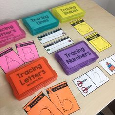 a table topped with lots of different types of letters and numbers cut out from plastic containers