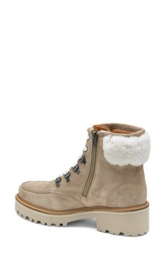 Fluffy genuine shearling lends a cozy touch to this lugged boot inspired by hiking styles. 2" heel 5" shaft (size 7) Lace-up style; side zip closure Cushioned footbed Leather and genuine-shearling (Brazil) upper/leather lining/rubber sole Made in Brazil Rugged Shearling Boots With Round Toe, Rugged Round Toe Shearling Boots, Sheepskin Boots With Round Toe For Cold Weather, Sheepskin Boots For Cold Weather With Round Toe, Rugged Shearling Winter Boots, Rugged Shearling Boots For Winter, Shearling Boots With Lug Sole And Round Toe, Winter Suede Moto Boots With Lug Sole, Winter Shearling Ankle Boots