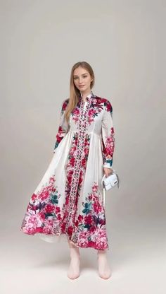 Elevate your style with the Flower Party Maxi Dress with Long Sleeve. This elegant abaya dress is perfect for any special occasion, featuring a long maxi silhouette and beautiful floral print design that exudes sophistication and grace. Whether you're attending a wedding, dinner party, or event, this dress is sure to make a statement. Product Features: - Long sleeve design for added elegance and modesty. - Flowy maxi length for a glamorous look. - Floral print adds a touch of femininity and charm. - Made from high-quality materials for comfort and durability. - Perfect for formal events or special occasions. - Available in various sizes to accommodate different body types. - Ideal for women who appreciate traditional and modern fashion. Elegant Long Floral Dress For Spring, Flowy Floral Print Floor-length Midi Dress, Elegant Maxi Dress With Floral Embroidery For Garden Party, Flowy Feminine Floral Embroidered Maxi Dress, Elegant Floral Embroidered Maxi Dress For Garden Party, Flowy Feminine Maxi Dress With Floral Embroidery, Feminine Flowy Maxi Dress With Floral Embroidery, Elegant Floral Embroidery Maxi Dress For Garden Party, Flowy Floor-length Floral Print Midi Dress