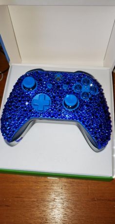 a close up of a controller in a box