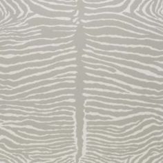 an animal print rug with white and grey stripes