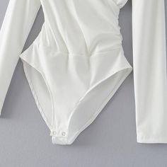 This long sleeve bodysuit featuring a plunging v-neck is the perfect item to bring you look together. Pair with jeans, leggings, skirt or shorts ... so be sure an visit our bottoms collection to find the perfect partner. Made with a polyester & cotton blend and comes in 6 fab colors. Long Sleeve Bodysuit Women, Black Backless Jumpsuits, Elegant Bodysuit, High Cut Bodysuit, Leather Bodysuit, Backless Jumpsuit, Rhinestone Studs, Green Lace, Lace Bodysuit