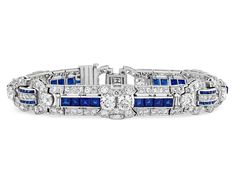 This magnificent bracelet by celebrated jeweler Raymond Yard was commissioned in the 1930s and features 189 European and mixed cut diamonds totaling approximately 10.87 carats, 12 baguette cut diamonds totaling approximately 0.60 carat and 60 square cut sapphires totaling approximately 6.24 carats. The New York jeweler gained renown for his use of high-quality gemstones and impeccable craftsmanship, both of which are exemplified in this unique Art Deco period bracelet. The sapphires exhibit thei Luxury Sapphire Jewelry With Square Cut, Art Deco Platinum Jewelry With Baguette Diamonds, Brilliant Cut Sapphire Bracelet For Wedding, Wedding Sapphire Bracelet With Brilliant Cut Diamond, Wedding Sapphire Bracelet With Brilliant Cut, Sapphire Diamond Jubilee Bracelet For Wedding, Luxury Sapphire Jewelry With Baguette Diamonds, Classic Sapphire Jewelry With Baguette Diamonds, Art Deco Aesthetic