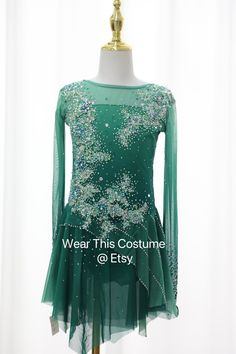 a green dress with sequins on it