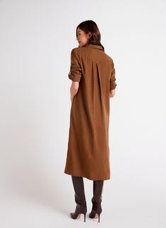 Elevate your wardrobe with our Duster Dress featuring a western yoke design and side slits for a modern twist on a classic silhouette. This dress comes with long sleeves that can be rolled up for versatility, making it perfect for any occasion. Pair it with your favorite boots for a chic look, or dress it down with sandals for a more casual vibe. 100% TENCEL™Lyocell Brown Long Sleeve Shirt Dress For Fall, Fall Daywear Long Maxi Dress, Long Shirt Dress For Fall Daywear, Long Sleeve Dress With Side Slits For Work, Long Shirt Dress For Daywear In Fall, Fall Daywear Dress With Unlined Sleeves, Fall Workwear Midi Dress With Side Slits, Long Sleeve Maxi Dress With Side Slits For Daywear, Long Sleeve Dresses With Side Slits For Daywear