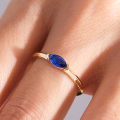 Here is Marquise Sapphire Ring for Women! This Stackable Birthstone Ring will be perfect matches as a other blue person gift 18K. With 10K 14K 18K Gold Customize Blue Gemstone Ring is best balance of minimalism.  This Horizontal Set Everyday Ring will be great marquise sapphire ring or marquise birthstone ring in her daily life as well! This dainty sapphire ring can be switch with her birthstone or birth month stone as well and can be 14K sapphire ring.  This Sturdy and Stunning lovely gemstone ring or September birthstone ring lover symbolizing your everlasting love & serves as a perfect gift for Daughter, women, wife, girlfriend or best friend! Please check our other birthstone gold rings: https://www.etsy.com/shop/Cristojuanna?ref=seller-platform-mcnav§ion_id=43057914 Ring Features: Ban 14k Gold Marquise Birthstone Ring Gift, Blue Opal Birthstone Ring In 14k Gold, Marquise Sapphire Ring In 14k Gold, Marquise Sapphire Birthstone Ring For Promise, 14k Gold Sapphire Birthstone Ring With Accent Stones, Marquise Blue Ring In 14k Gold, 14k Gold Marquise Cut Sapphire Ring As Gift, Marquise Sapphire Ring In Yellow Gold As Gift, Yellow Gold Marquise Sapphire Ring Gift