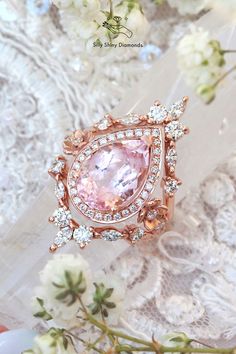 an image of a pink ring with diamonds on it