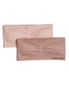 PRICES MAY VARY. Calvin Klein stocks her drawer with this 2 pack strapless bandeau Set includes 2 Bras Calvin Klein logo at band. Seamless style for all day comfort Assorted Colors Calvin Klein Girls, Strapless Bandeau, Lounge Lingerie, Calvin Klein Woman, 2 Pack, Calvin Klein, Lingerie, Band, Clothes For Women