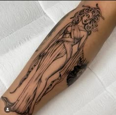 a woman's arm with a tattoo on it