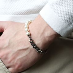 Hand-strung crystal cream white pearls attached to silver curb chain. Materials: stainless steel finishings and chain, crystal pearls Measurement: 7 in adjustable to 8.5 in IG: @sib.somewhereinbetween WEB: thesibshop.com White Pearl Bracelet With Chain Detail, White Pearl Bracelet With Chain, Elegant White Silver Chain Bracelet, Modern White Metal Chain Bracelet, Modern White Pearl Bracelets, White Stainless Steel Formal Bracelets, Formal White Stainless Steel Bracelets, Elegant White Bracelet With Silver Chain, Modern Adjustable White Chain Bracelet