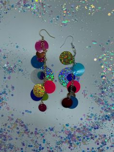 "Fun! Circle Sequin Earrings! In Gold & Silver! ~Made from circle sequin mix with gold or silver split rings, gold or silver drop chain and gold or silver fish hook earrings. ~Circle mix includes lil circles, medium circles and large circle shapes in a variety of colors! ~All color of and placement of sequins are random and asymmetric :) ~Earrings measure 3\" inch in drop length roughly by about a 1/2\" inch in width roughly." Circular Metal Party Earrings, Multicolor Dangling Charms Jewelry For Party, Multicolor Jewelry With Dangling Charms For Party, Multicolor Nickel-free Earrings For Party, Nickel-free Multicolor Earrings For Party, Multicolor Circle Earrings For Party, Multicolor Pierced Earrings For Party, Party Jewelry With Iridescent Ear Wire, Fun Dangle Earrings For Party