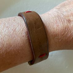 Double Leather & Brass Bracelet Fits A 6.5” Wrist Best. Brown Leather On Outside Of Bracelet And Red Leather On The Inside Sewn Together With Red Thread. Brass Closure. Excellent Unworn Condition. Red Adjustable Bracelets For Everyday, Adjustable Red Bracelets For Everyday, Red Bangle Bracelet For Everyday, Red Everyday Bangle Bracelets, Everyday Red Bangle Bracelets, Adjustable Rectangular Red Wristlet, Red Adjustable Leather Bracelet, Adjustable Brown Wristlet For Everyday Use, Casual Red Leather Bracelet As Gift