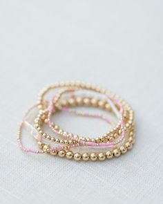 - 2mm gold filled ball beads mixed with color glass seed beads (one pink and gold bracelet) - 6.5 inches Cool Piercing Ideas, Cute Bracelet Ideas, Cool Piercing, Necklaces Cute, Earrings Cool, Fantasy Earrings, Bracelets Ideas, Cute Bracelet