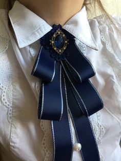 Elegant Blue Bow For Wedding, Gift Bow Brooch, Classic Blue Brooches For Gifts, Formal Brooches With Satin Bow, Elegant Bow Tie Brooches For Gift, Elegant Bow Tie For Gift, Elegant Blue Bow Tie For Party, Elegant Blue Ribbon Bow, Blue Bow Tie With Ribbon As A Gift