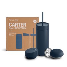 a blue travel mug next to a carton of cartier 3 - in - 1 system