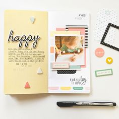 an open scrapbook with the words happy written on it