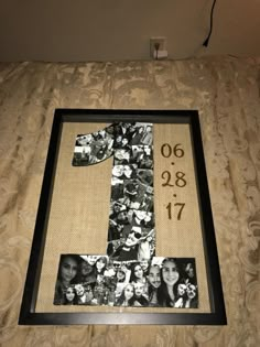 the number one is made out of photos and has been framed in a black frame