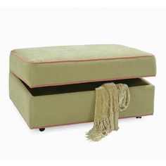 an ottoman with a blanket on it