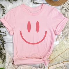 You will love this vintage happy face tshirt! These smiley tees are so soft and comfortable so they're great for lounging at home or running around doing errands! These retro smile face shirts make great gifts for your bestie, daughter, sister or anyone who loves giving off happy, positive vibes! These t-shirts are not made as an oversized fit so please make sure to check the size chart and order up a few sizes if you are looking for that baggier fit! *PRODUCT DESCRIPTION* -Bella+Canvas 3001 Unisex Jersey Short Sleeve Tee -100% cotton (fiber content may vary for different colours) -Light fabric -Tear-away label -Shirt colour may vary slightly due to variations in lighting and monitor brightness *SIZING* -Retail fit (slightly fitted) -Runs true to size -See size guide in product photos for Gifts For Your Bestie, Vintage Smiley Face, Positive Tshirts, Smiley Face Tee, Smiley Face Tshirt, Label Shirt, Good Vibes Shirt, Smiley Face Shirt, Happy Tees