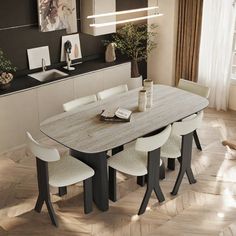 a dining table with four chairs and a vase on it