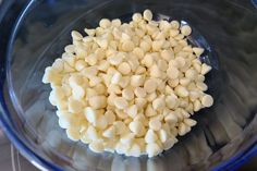 a bowl filled with white beans on top of a table