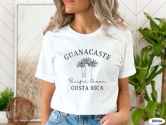 IMPORTANT: Please note that the Christmas order deadline has passed and whilst you may still receive your order in time, unfortunately, there is no guarantee. This cute Guanacaste shirt is the perfect outfit for your trip to Costa Rica. The design is printed on a soft, unisex Bella+Canvas 3001 short-sleeve tee. Get one t-shirt for yourself or as a gift for your travel-loving friend! DETAILS * Material: 100% combed and ring-spun cotton (Black, White, Navy) / 52% combed and ring-spun cotton & 48% polyester (Dark Grey Heather) / 90% combed and ring-spun cotton & 10% polyester (Athletic Heather) * Light fabric (4.2 oz/yd² (142 g/m * Text/graphic color: black or white (see photos) * Soft and comfortable * Retail fit  * Runs true to size Note:  * Any cuffs and knots are for styling purposes only Custom Print Crew Neck Top For Vacation, Costa Rica Clothes, Vacation Costa Rica, Trip To Costa Rica, Beach Tshirt, Costa Rica Vacation, Text Graphic, Beach T Shirts, Costa Rica