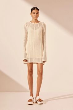 Long sleeve mini dress in a semi-sheer cotton crochet. Shona Joy, Mini Slip, Ivory Dresses, Crochet Round, Cotton Crochet, Samara, Long Sleeve Mini, Long Sleeve Mini Dress, Sweater Skirt