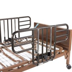 a hospital bed with metal rails and wooden slats on it's sides, against a white background