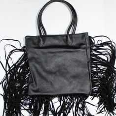 Looking Or A Fun Edgy Bag To Add To You Aesthetic? Try This Black New Without Tags (Tag Is On Bag Without Paper Tag (See Images) Never Used). It Has Long Tassels On The Sides And Bottom To Give It A Biker/Edgy/Babe Aesthetic. Casual And High Fashion Looking All In One! Condition: Nwot Size: 13 ½ Inches Tall X 13 In Across X 1 ½ Inches Depth Drop Handle 9 ½ In Drop To Bottom Of Bag 23 In Handle To Bottom Tassels 29 ¼ At Longest Tassel Length 18 Inches On Sides Tassel At Bottom 7 Inches Materials: Trendy Fringe Bags For Shopping, Trendy Fringe Satchel Shoulder Bag, Trendy Fringed Satchel Shoulder Bag, Chic Fringe Bags For Fall, Black Casual Bags With Tassels, Casual Black Bags With Tassels, Trendy Satchel Bag With Fringe, Trendy Fringe Satchel Bag, Trendy Fringed Satchel Bag