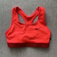 Nike Medium Support Sports Bra Neon Orange Red Color Racer Back No Pads Nor Slots For Padding Nwt Size: Xs 12.5 Inches Pit To Pit / 10.5 Inches Long Functional Red Activewear With Light Support, Red Sportswear Activewear With Light Support, Red Light Support Activewear, Red Stretch Sports Bra For Running, Functional Red Activewear For Running, Red Casual Activewear For Sports, Red Breathable Sports Bra, Red Nike Activewear For Gym, Red Athleisure Sports Bra For Running