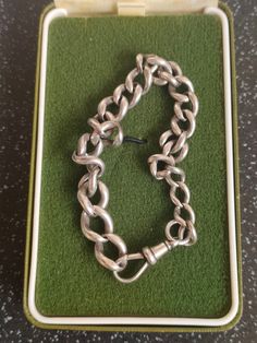 Pre-owned, in good condition. The box is for display only. Length: ~ 8 inches long ( 20 cm ) Weight: ~ 20.1 g Each link on the chain has the lion passant mark, faded. Maker's Mark SBRs. If you have any questions please feel free to contact me.  I hope you'll be happy with your purchase but I appreciate that it is sometimes difficult to buy based on a picture. If when you receive your purchase you decide that it isn't suitable please feel free to return it for a full refund. I hope you will have Silver Chain Bracelet With Rectangular Links And Box Clasp, Vintage Adjustable Silver Chain Bracelet, Luxury Rectangular Sterling Silver Chain Bracelet, Vintage Adjustable Chain Link Bracelet, Silver Vintage Chain Link Bracelets, Vintage Silver Chain Bracelet With Polished Finish, Chain Link Bracelet, Makers Mark, Chain Link