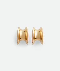 "Find BOTTEGA VENETA H Beam Large Earrings on Editorialist. 18k gold-finish sterling silver earrings. Hand-enameled. Pin butterfly closure. External diameter: 31 mm | 0.7\". Thickness: from 14.5 to 19.5 mm | 0.3\" to 0.5\". Rail height: from 8.2 to 12.2 mm | 0.1\" to 0.3\". Color: Bright Orange. Due to hygiene-related reasons, this piece may not be returned. Sterling Silver." Yellow Gold Enamel Earrings For Pierced Ears, Modern Gold Enamel Earrings, Modern Gold Earrings With Enamel, Yellow Gold Enamel Clip-on Earrings, Yellow Gold Clip-on Enamel Earrings, Luxury Yellow Gold Enamel Earrings, Luxury Yellow Gold Plug Earrings, Classic Gold Enamel Earrings, Yellow Gold Enamel Hoop Earrings For Pierced Ears